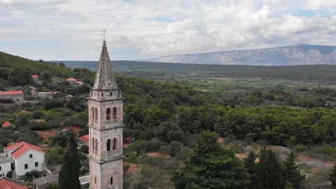 Drone view of a bell tower in the mountains 03 Video stock 139761316