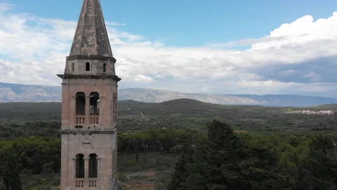 Drone view of a bell tower in the mountains 04 Video stock 139761322