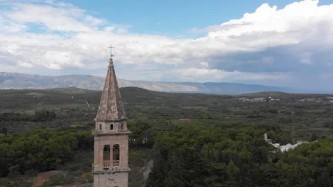 Drone view of a bell tower in the mountains 06 Stock Footage