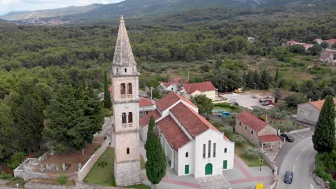 Drone view of a bell tower in the mountains 02 Video stock 139761776