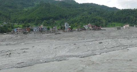 Drone view of Betrawati, Nepal of thick flood silt deposit in front of Stock Footage 345928255