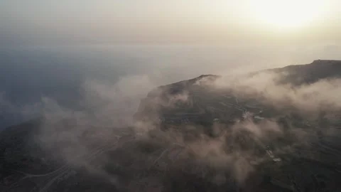 Drone view between the clouds, sunset time. Sea, cliffs. Malta island Stock Footage 274205185