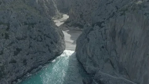 Drone view between a spectacular rock formation and the sea Stock Footage 197560931