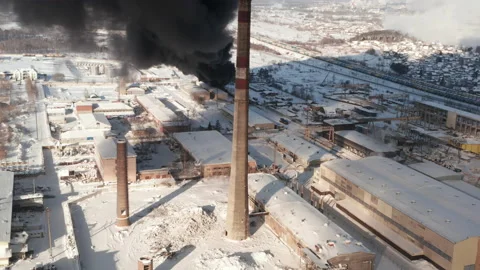 Drone view of big fire, heavy smoke on burning industrial building at a factory Stock Footage 231364058