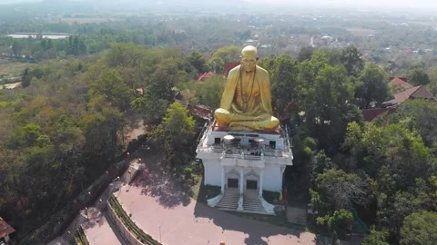 Drone view of a big monk statue close to highway in Chiang Mai, Lampang Road Stock Footage 238628487