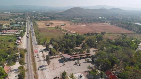 Drone view of a big monk statue close to highway in Chiang Mai, Lampang Road 動画素材 238628551