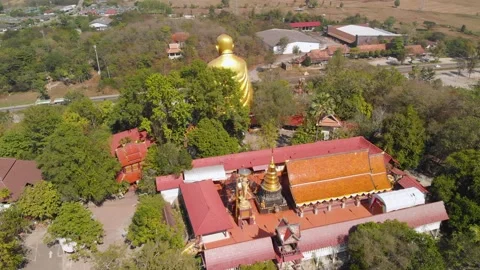Drone view of a big monk statue close to highway in Chiang Mai, Lampang Road Stock Footage 238628612