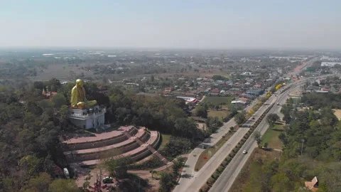 Drone view of a big monk statue close to highway in Chiang Mai, Lampang Road Stock Footage 238628671