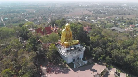 Drone view of a big monk statue close to highway in Chiang Mai, Lampang Road Stock Footage 238629220