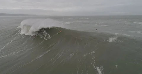 Drone view of a Big Wave Surfer in Nazare, Portugal Stock Footage 111834513