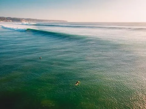 Drone view of big waves at sunset. Waves in Bali and coastline Stock Photos