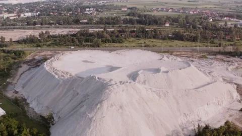 Drone view of a big white heap of sand. Pollution after construction. Stock Footage 145883503