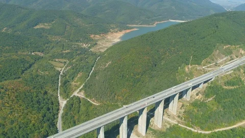 Drone view of blue lake and Bebresh Viaduct motorway in Bulgaria Stock Footage 115732617