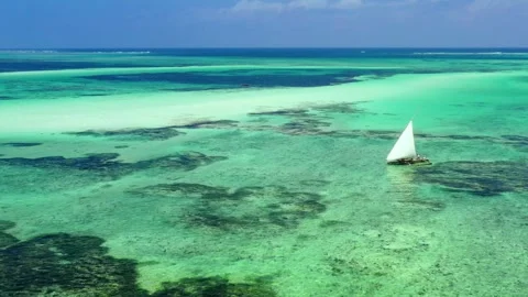 Drone view of boat floating on the shallow water of the Indian Ocean. Stock Footage 261006184