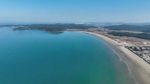Drone view of boat moving across calm sea towards distant islands Stock Footage 314629015