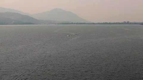 Drone view of a boat moving at high speed at sunset. High quality 4k footage Stock Footage 249133154