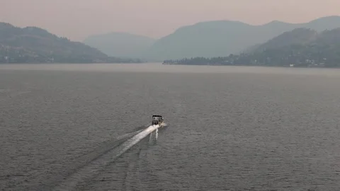 Drone view of a boat moving at high speed at sunset. High quality 4k footage Stock Footage 249133222