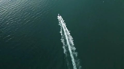 Drone view of a boat the turquoise clear waters. Top view of a motor boat Stock Footage 252414341