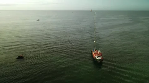 Drone view of boats deploying fiber optic cable in the sea near Porlamar Vidéo 302806502
