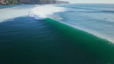 Drone view with breaking ocean waves in ocean on Impossibles beach, Bali 動画素材 343384533