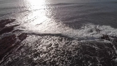 Drone view of breaking wave on a sunny day Video stock 106425723