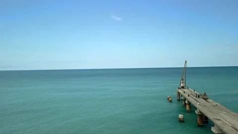 Drone view of the bridge in the beautiful black sea on which there is a crane Video stock 237597256