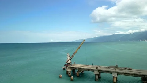 Drone view of the bridge in the beautiful black sea on which there is a crane Video stock 237597350