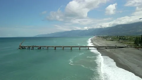 Drone view of the bridge in the beautiful black sea on which there is a crane Video stock 237597389