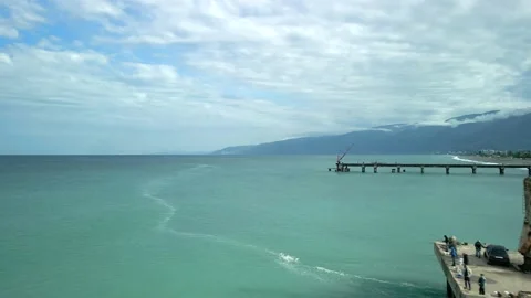 Drone view of the bridge in the beautiful black sea on which there is a crane Video stock 237597413