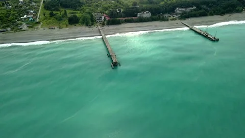 Drone view of the bridge in the beautiful black sea on which there is a crane Video stock 237605427