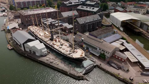 Drone view of Brunel's SS Great Britain rests at the dock in Bristol Harbourside Stock Footage 323009309
