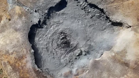Drone View of Bubbling Geothermal Mud Pool in Iceland Stock Footage 309833448