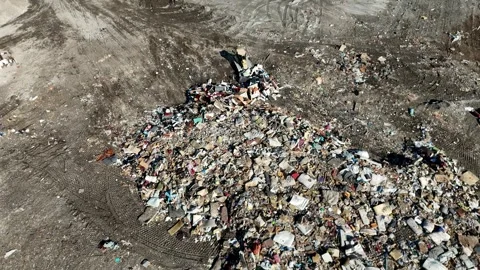 Drone View of Bulldozer Spreading Trash at Landfill 스톡 동영상 305100678