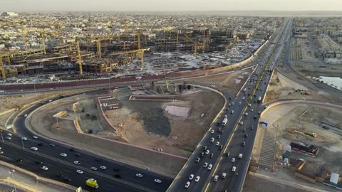 Drone view of busy complex road junction and mega construction in Saudi Arabia Stock Footage 285325061