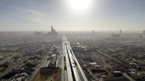 Drone view of busy complex road junction in the hazed mornig Saudi Arabia Riyadh Stockbeeldmateriaal 285328661