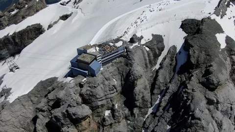 Drone view of cable car station on the top of Titlis mountain in Switzerland  Stock Footage 115973378