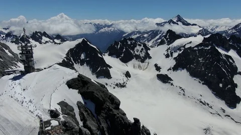 Drone view of cable car station on the top of Titlis mountain in Switzerland  Stock Footage 115973399