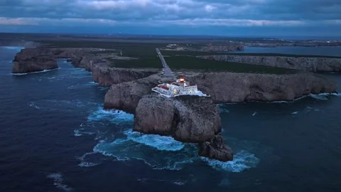 Drone view of Cabo de Sao Vicente lighthouse at night under dramatic clouds Video stock 344288469