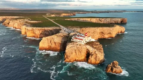 Drone view of Cabo de Sao Vicente Lighthouse at sunset with lantern Stock Footage 344956578