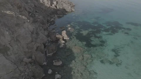 Drone view of cala Na Xeringa crystal-clear sea waters in Menorca - DLog Stock Footage 246586827