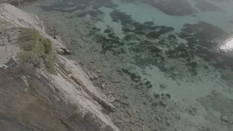 Drone view of cala Na Xeringa crystal-clear sea waters in Menorca - DLog Stock Footage 246586830