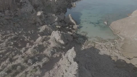 Drone view of cala Na Xeringa crystal-clear sea waters in Menorca - DLog Stock Footage 246586831