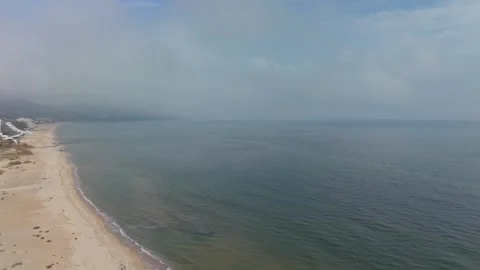 Drone view of calm sea under soft cloudy autumn sky Stock Footage 321047140