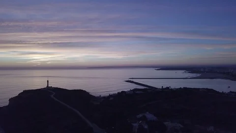 Drone view of the of the calming ocean at sunset Stock Footage 128407453