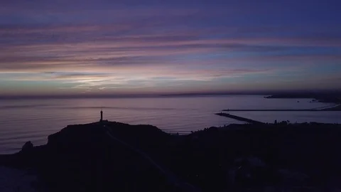 Drone view of the of the calming ocean at sunset Stock Footage 128407470