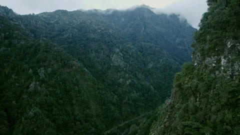 Drone view of canyon in mountains in cloudy day on Madeira Stock Footage 304347618