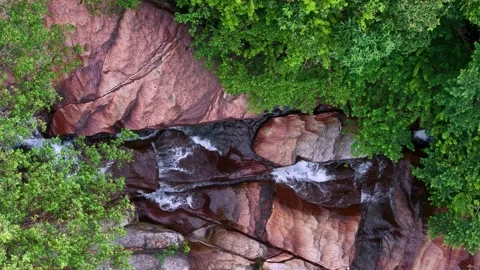 Drone view captures Batu Ferringhi Waterfall cascading Stock Footage 332190277