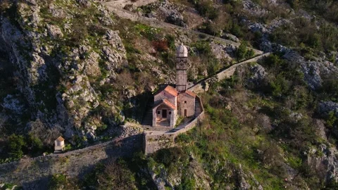 Drone view captures beauty of Boko Bay, old church of St. John in Kotor historic Video stock 243780652