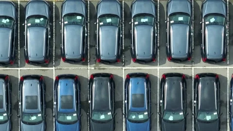 This drone view captures a large automobile storage area. Video stock 306734694