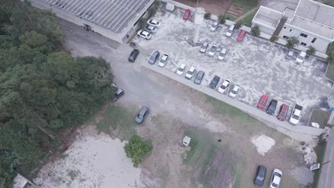 Drone view car leaving gym parking lot urban traffic movement Stock-Footage 336643557
